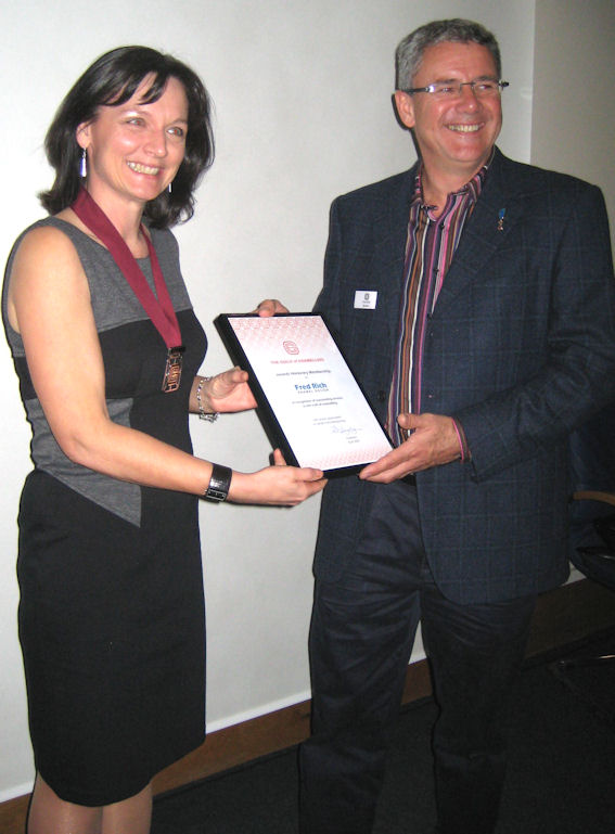 Rachel Gogerly, Chairman presenting Honorary Membership Certificate to Fred Rich at Celebratory Guild Dinner, York Conference 2009 fred rich honorary membership goe agm april09